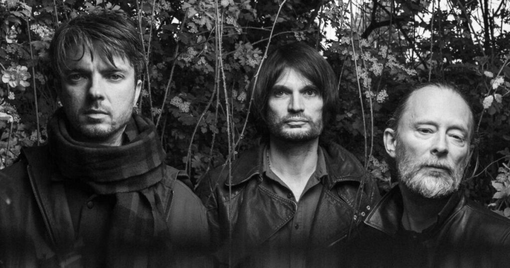 The Smile – Thom Yorke, Jonny Greenwood and Tom Skinner, 2022 publicity photo by Alex Lake