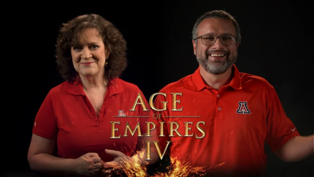 University of Arizona faculty Alison Futrell and Paul Milliman with Age of Empires IV branding